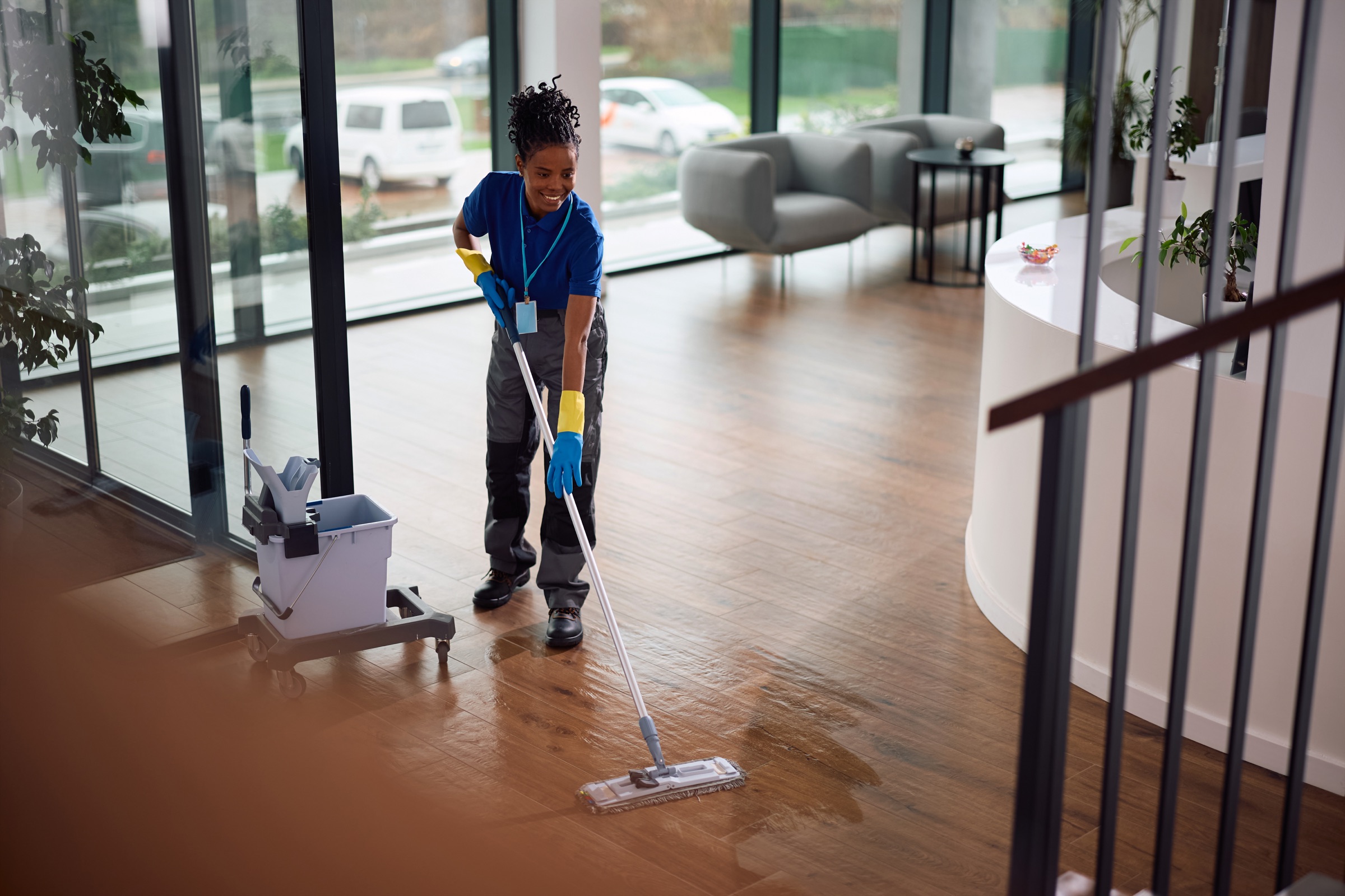 Professional cleaning team servicing a modern office lobby